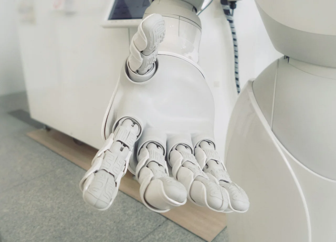 Close-up of an articulated white robot hand and wrist