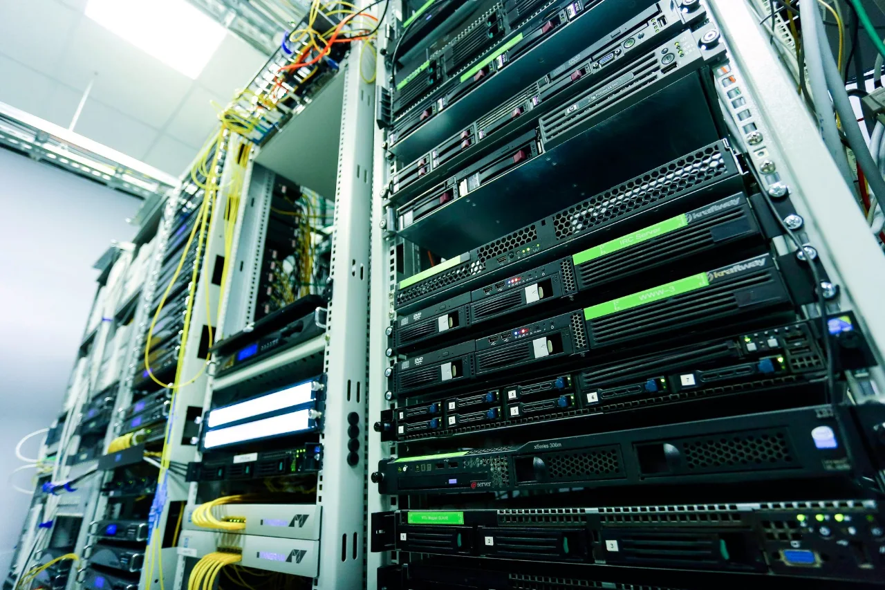 Network servers with green status lights inside a server rack