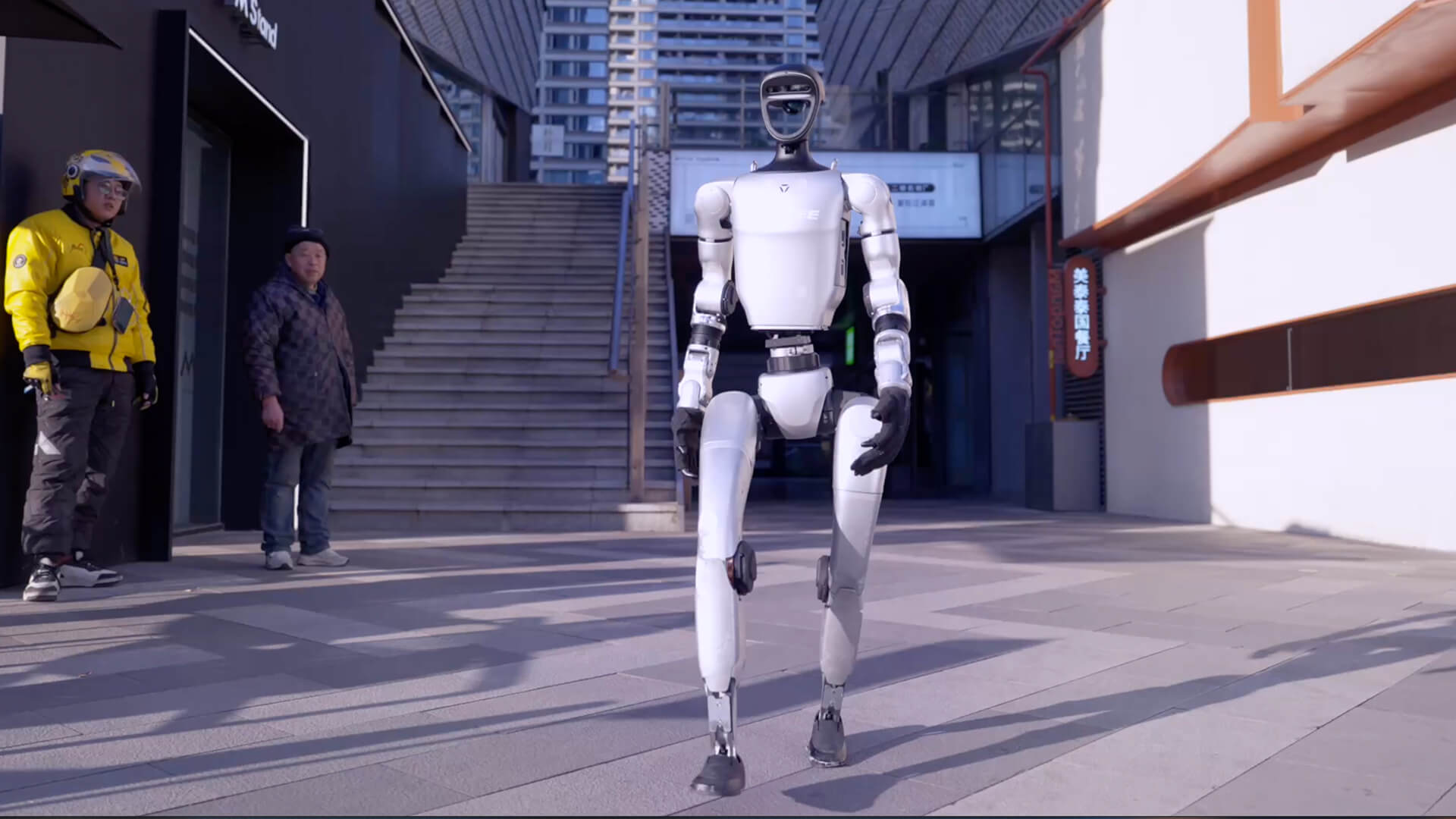 Unitree G1 humanoid walking outside in a scene from Unitree’s official product page